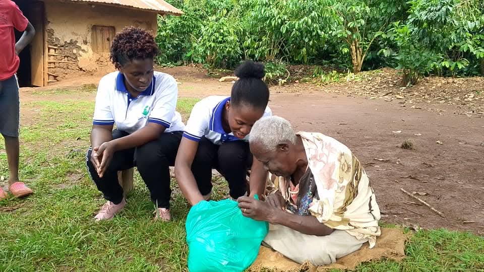 Staff delivering care and supplies to an elderly guardian